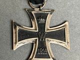 a close up of a cross with a crown on top of it