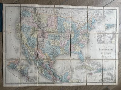 an old map of the united states of north america on a wooden table