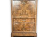 an image of a wooden chest of drawers on a white background