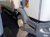 a truck that is parked next to another truck