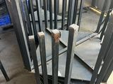 several pieces of steel are stacked on top of each other in a warehouse