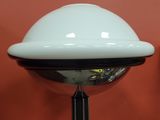 a white light that is on top of a black pole