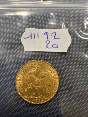 a close up of a coin in a plastic bag on a table