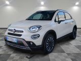 a white fiat suv parked in a garage with a checkered floor