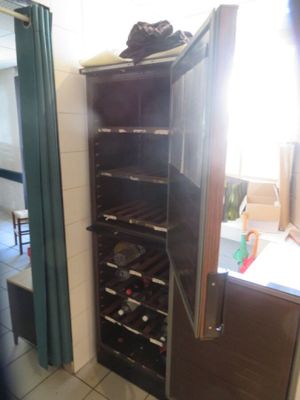 a wine rack in the corner of a kitchen