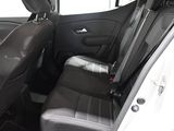 the back seats of a car are black and white with a checkered seat cover