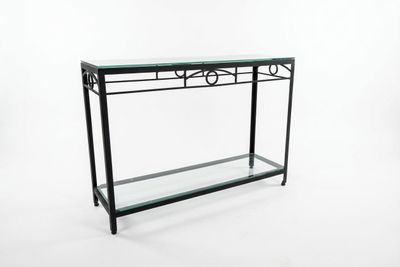 a glass console table with a metal frame and glass top