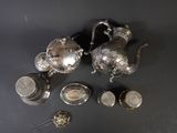 a lot of silver items that are on the table