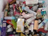 many different types of toothbrushes in a plastic container