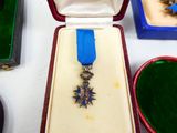 a small box with a blue ribbon and a star on it