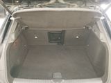 a trunk of a car with a bike in the back of it