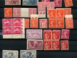 a collection of stamps and stamps on display on a table