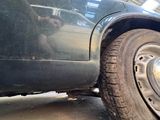 a close up of a car with a flat tire