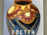 a book with a picture of a vase on it