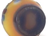 a close up of a glass object on a white surface