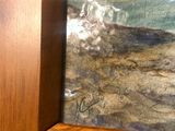 a picture of a cat that is sitting in a picture frame