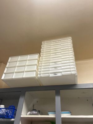 a shelf that has many containers on it