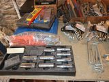 a lot of tools sitting on a table in a room