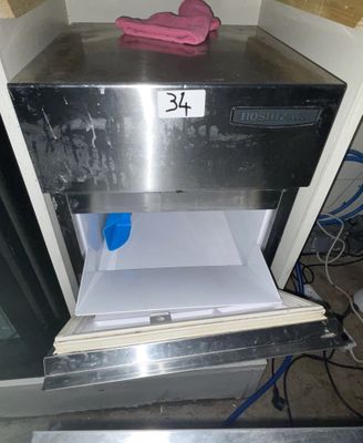 a pink glove sitting on top of an open oven