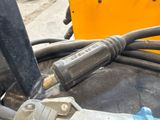 a close up of a machine that has a hose attached to it