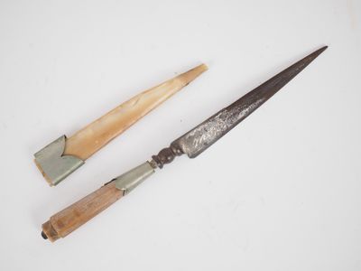 two different types of knifes on a white surface
