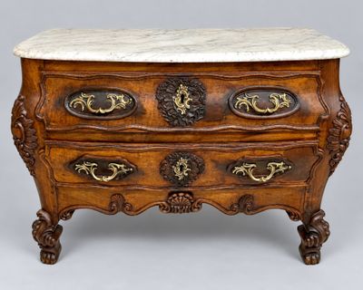 an antique chest of drawers with marble top and brass handles
