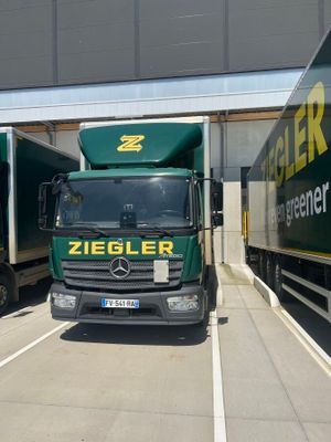 two trucks that are parked next to each other