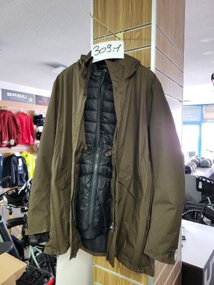 a coat hanging on a rack in a clothing store