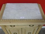 an image of a white marble topped table with a drawer