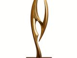 bronze sculpture of a woman ' s face on a wooden base