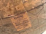 a large globe with a map on it on a table