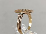an image of a gold ring with a flower on top of it