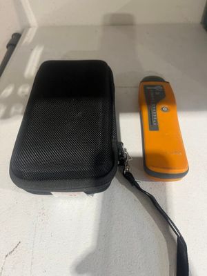 a black case with a yellow object next to it