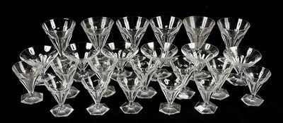 a lot of wine glasses that are sitting on a table