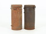 two old metal trash cans sitting next to each other