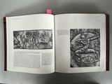 an open book with a picture of a man riding a horse