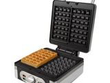 a close up of a waffle maker on a white background