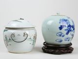two vases sitting next to each other on a table