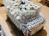 many containers of food sitting on a pallet in a room