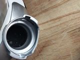 a silver blender sitting on top of a wooden table