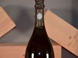 a bottle of wine that is sitting on a table