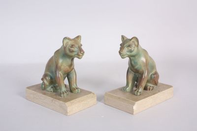 pair of bronze figurines of a cat and a dog on wooden bases