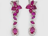 a pair of ruby and diamond earrings