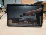 a laptop screen with a picture of a hand reaching for something