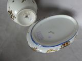 a bowl and a cup sitting on a table