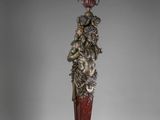 une statue antique représentant un homme coiffé d'une couronne
