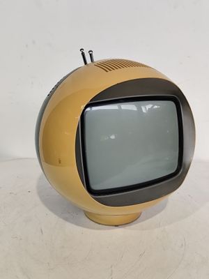 a small television sitting on top of a white table