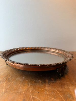 an image of a wooden table with a mirror on top of it