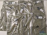 six pairs of men ' s adidas pants are wrapped in plastic