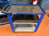 a blue cart that is sitting on the floor